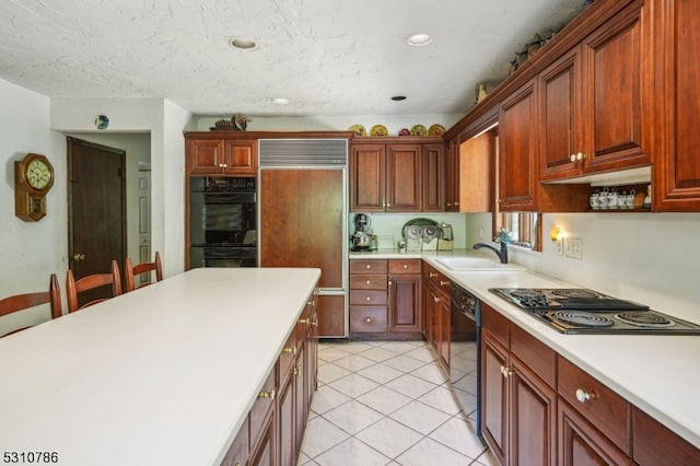 kitchen with black appliances, a textured ceiling, light tile patterned floors, and sink