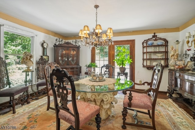 dining room featuring a chandelier and hardwood / wood-style floors