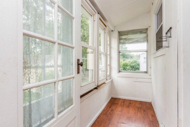 unfurnished sunroom with vaulted ceiling and plenty of natural light