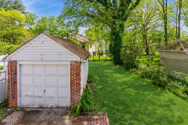 garage featuring a yard