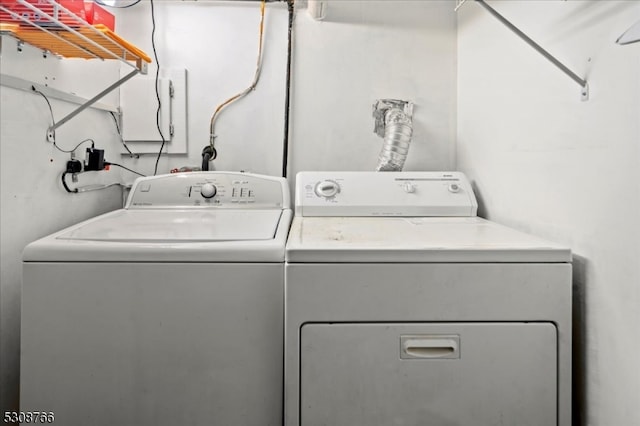 clothes washing area featuring independent washer and dryer