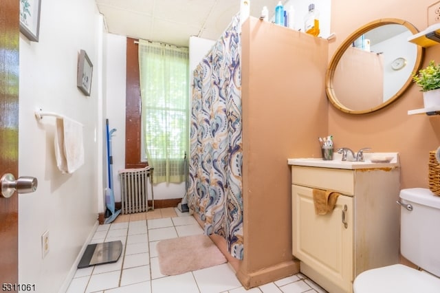 bathroom featuring vanity, toilet, a shower with curtain, and tile patterned flooring