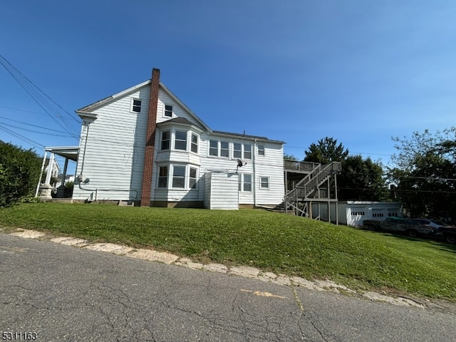 view of home's exterior with a lawn