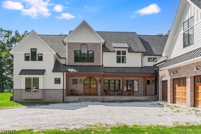 exterior space featuring covered porch and a garage