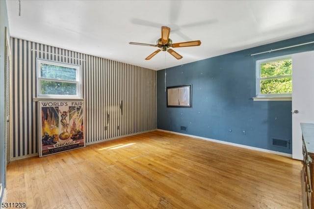 unfurnished room featuring ceiling fan and light hardwood / wood-style flooring