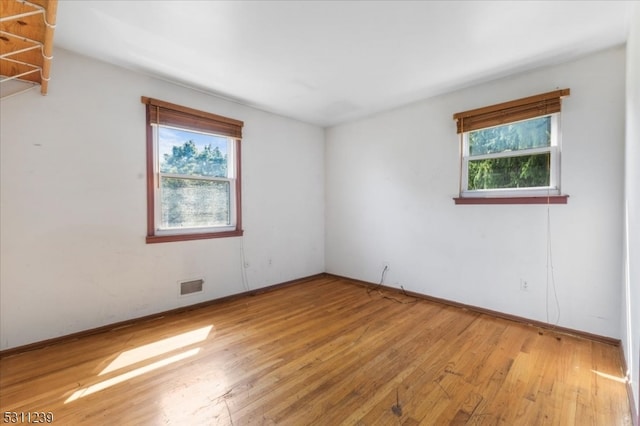 unfurnished room featuring light hardwood / wood-style flooring