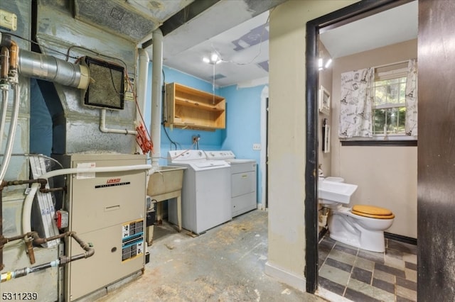 bathroom with vanity, toilet, and independent washer and dryer