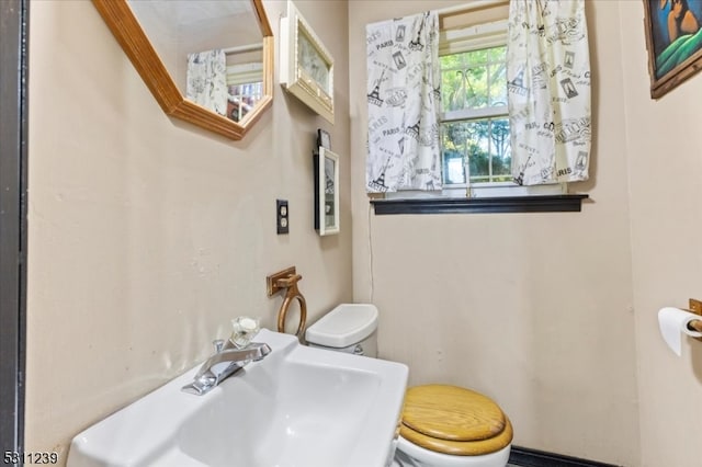 bathroom with toilet and sink