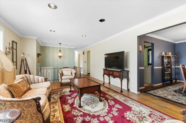 living room with hardwood / wood-style floors and ornamental molding