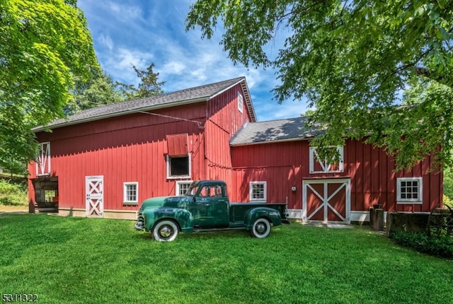 view of outdoor structure with a lawn