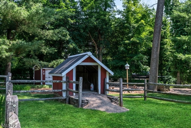 view of outbuilding featuring a lawn