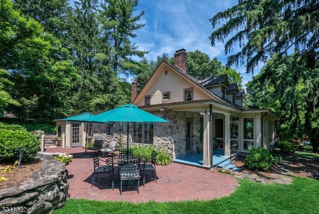 rear view of house with a patio