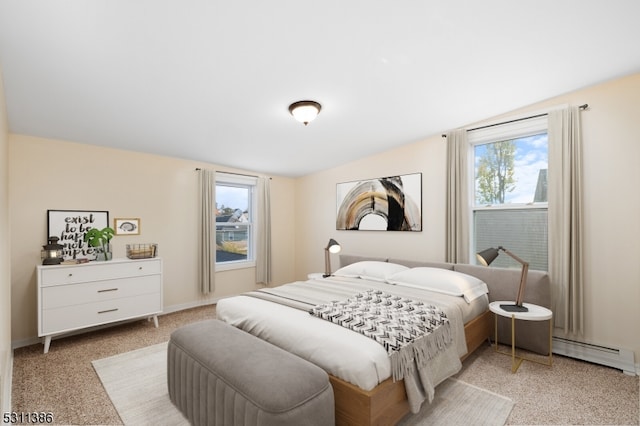 bedroom with vaulted ceiling, light carpet, and a baseboard radiator