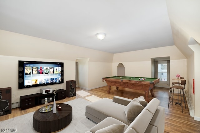 game room with lofted ceiling, pool table, and light wood-type flooring