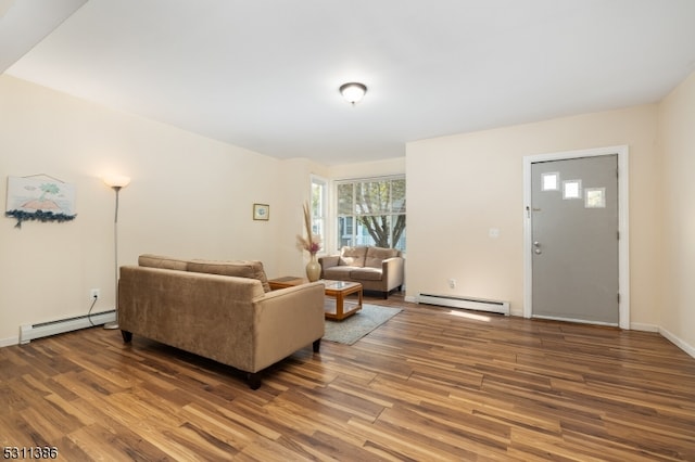 living room with hardwood / wood-style flooring and baseboard heating