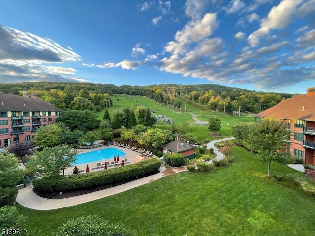 community pool featuring a yard