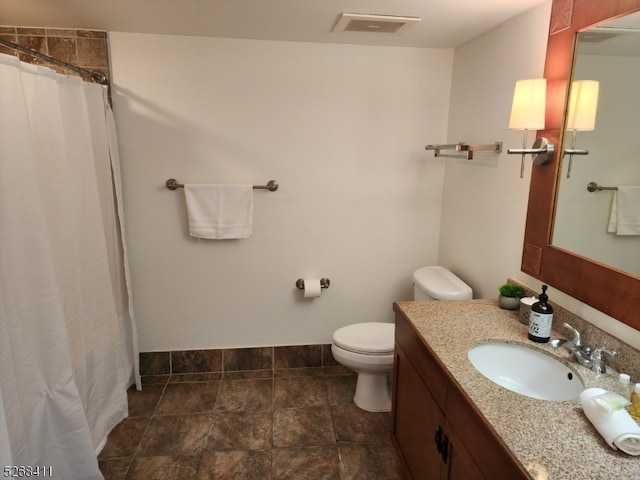 bathroom with vanity, toilet, and a shower with curtain