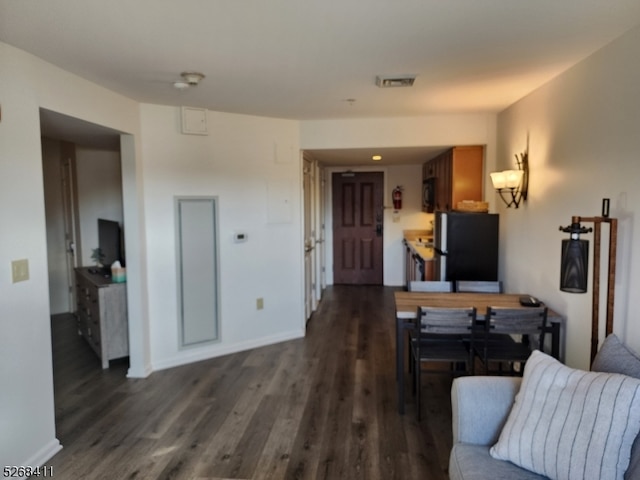 living room featuring dark hardwood / wood-style flooring