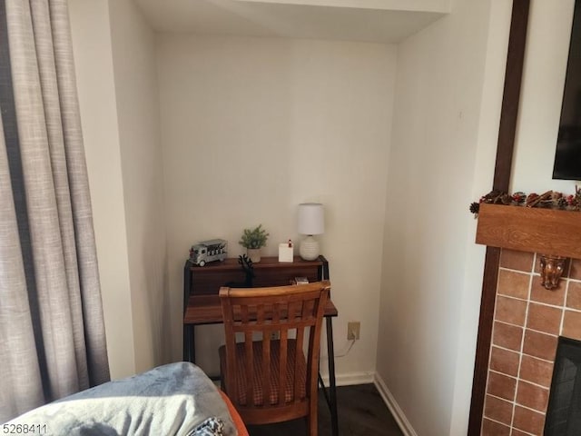 interior space with a fireplace and baseboards