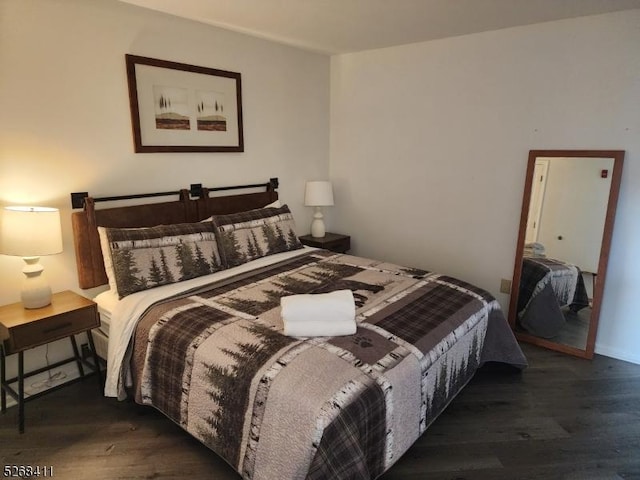 bedroom featuring wood finished floors