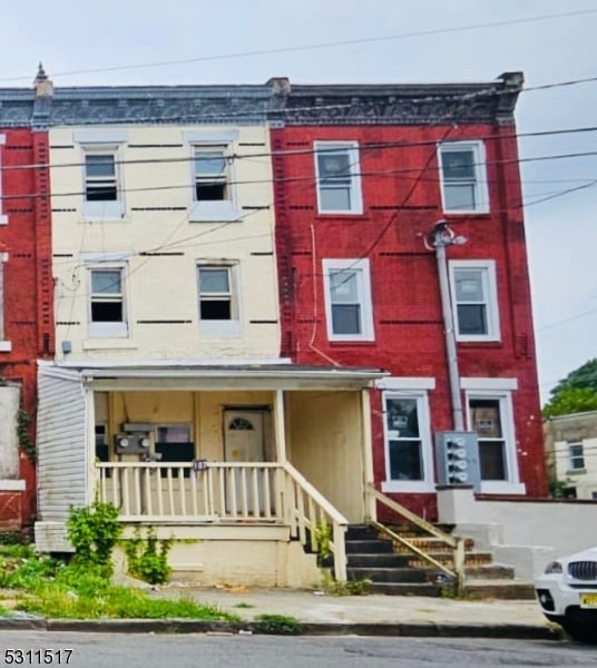 multi unit property featuring a porch