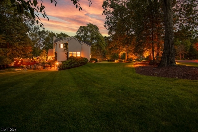 view of yard at dusk