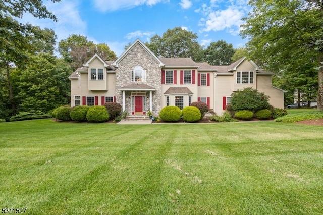 colonial home with a front yard