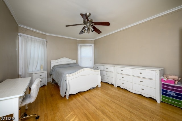 bedroom with light wood-type flooring, crown molding, and ceiling fan