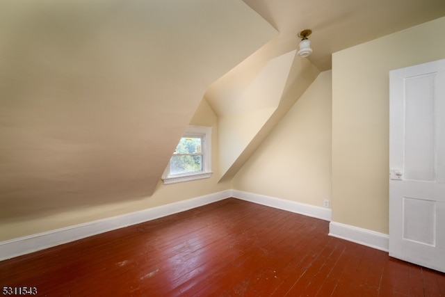 bonus room featuring lofted ceiling and hardwood / wood-style flooring