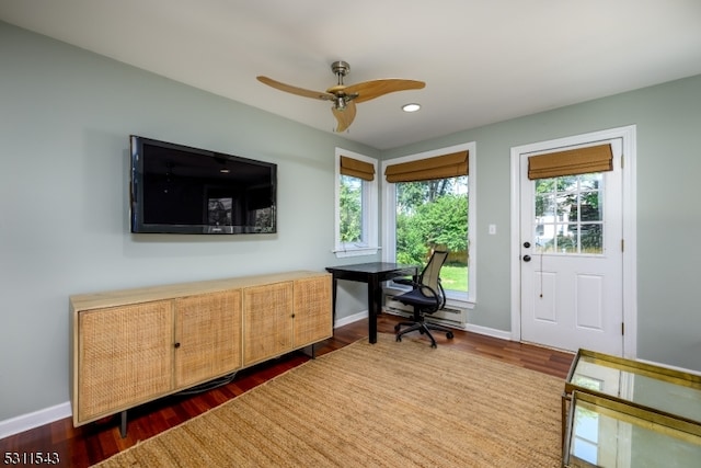 office area featuring dark hardwood / wood-style flooring and ceiling fan