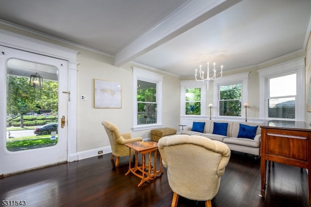 living room featuring crown molding, dark hardwood / wood-style flooring, plenty of natural light, and a chandelier