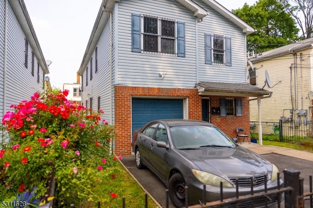 view of front of property featuring a garage