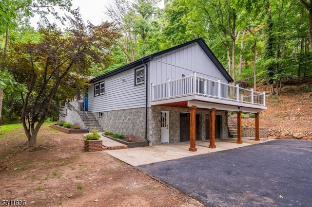 view of front of property featuring a patio area and a deck