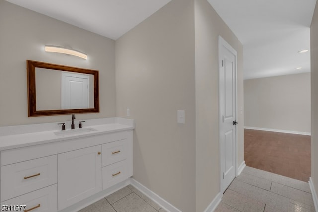 bathroom with tile patterned flooring and vanity