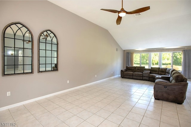 tiled living room with ceiling fan and lofted ceiling