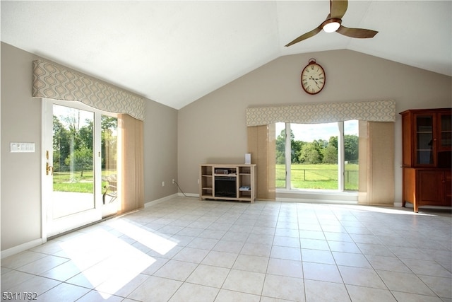 unfurnished living room featuring lofted ceiling, ceiling fan, and light tile patterned floors