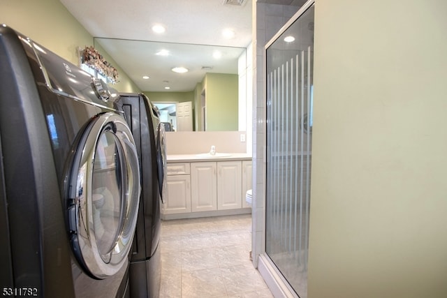 laundry area with washer / clothes dryer and sink