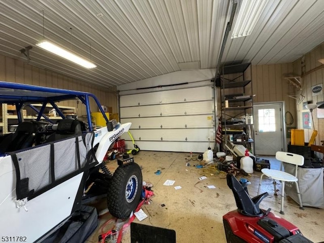 garage featuring wooden walls