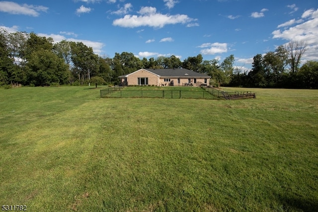 view of yard with a rural view