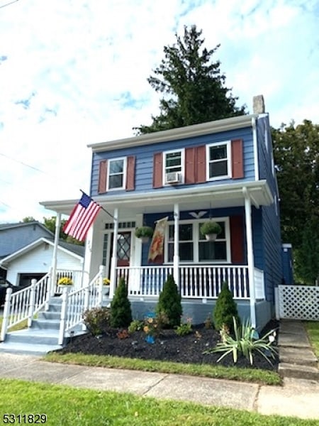 view of front of home with a garage and covered porch