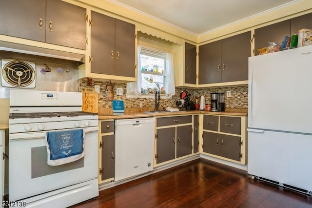 kitchen with white appliances, sink, decorative backsplash, and dark hardwood / wood-style floors