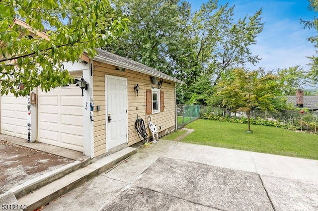 view of outbuilding with a lawn