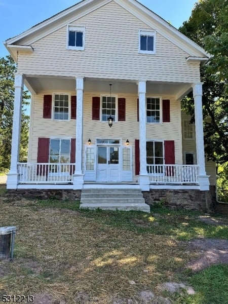 neoclassical home with a porch