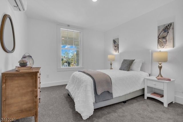 bedroom with carpet floors and an AC wall unit