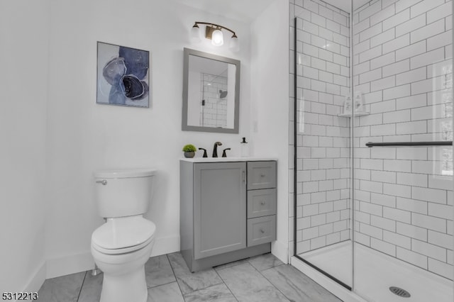 bathroom with toilet, a shower with shower door, and vanity