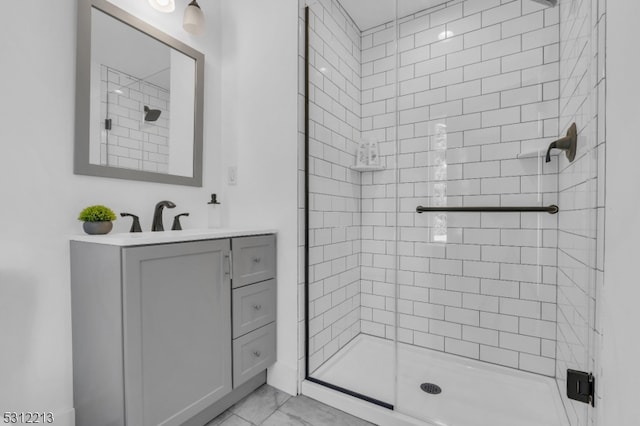 bathroom featuring vanity and a shower with door