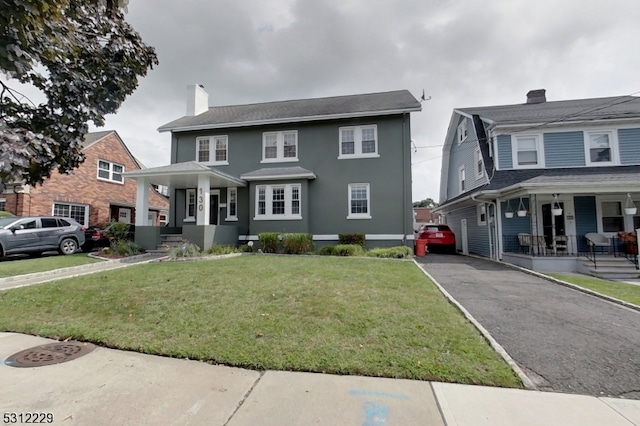 view of front facade with a porch and a front yard