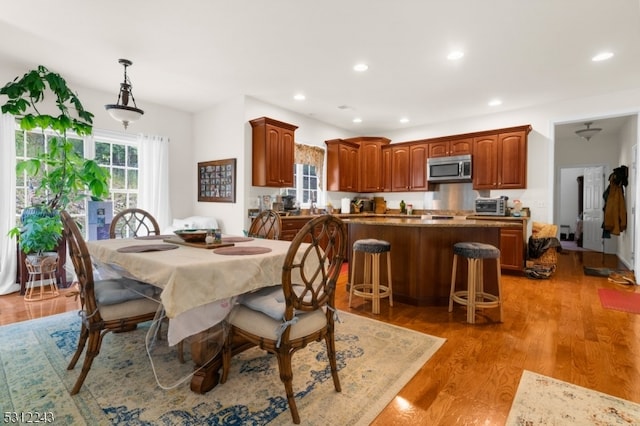 dining space featuring light wood-type flooring