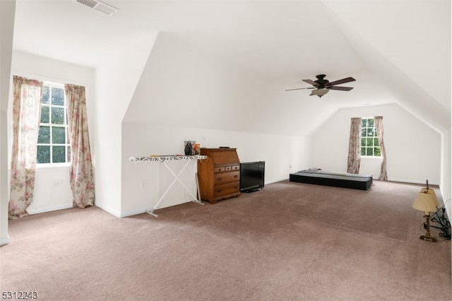 additional living space with lofted ceiling, ceiling fan, and carpet floors