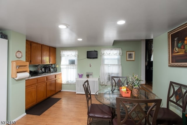 kitchen featuring light wood-type flooring and radiator